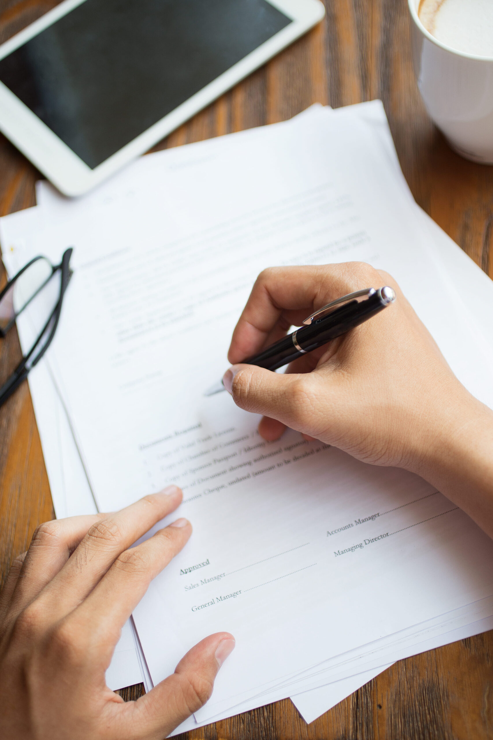 unrecognizable-man-filling-application-form (1) abogados herencias burgos